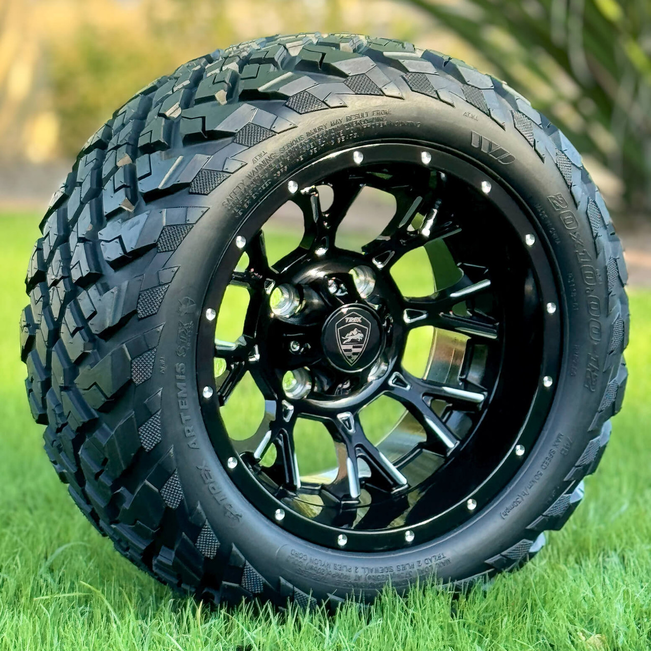 12 inch SPARTAN Black/Milled Golf Cart Wheels and 20x10-12 ARTEMIS All Terrain Golf Cart Tires in Grass
