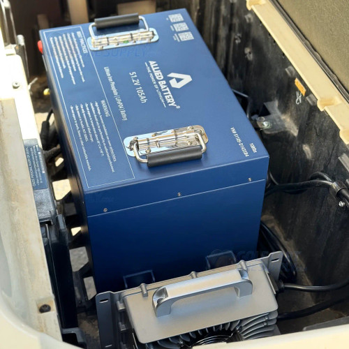 ALLIED 48V 105Ah BIG BOX Lithium Kit installed in a Club Car Tempo battery bay ALLIED 48 volt 105Ah BIG BOX lithium golf cart battery kit sitting in a Club Car Tempo battery bay with the onboard charger below it