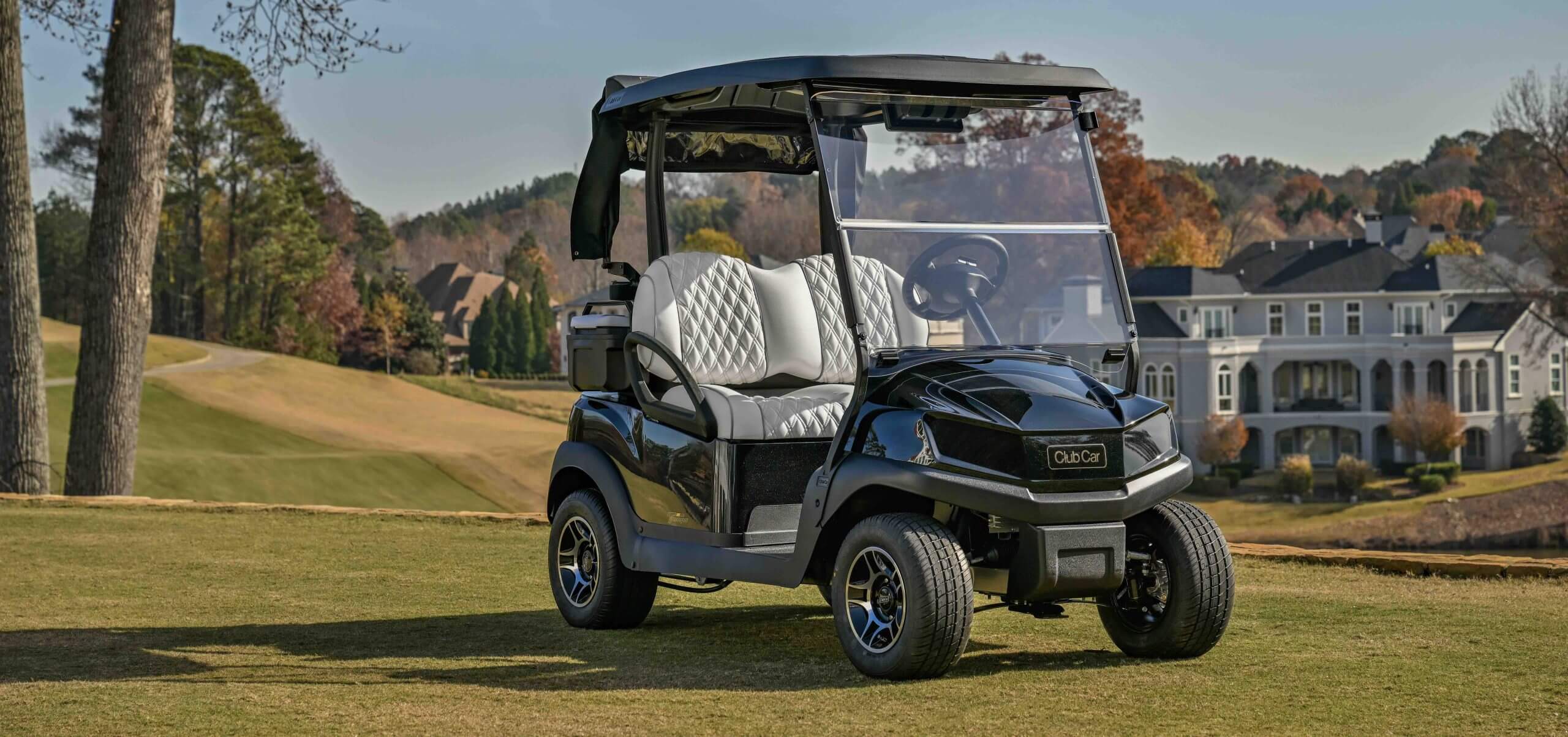 08 Best Golf Cart 2026 Club Car Tempo Black 2026 Club Car Tempo golf cart with diamond stitched seats on a golf course fairway