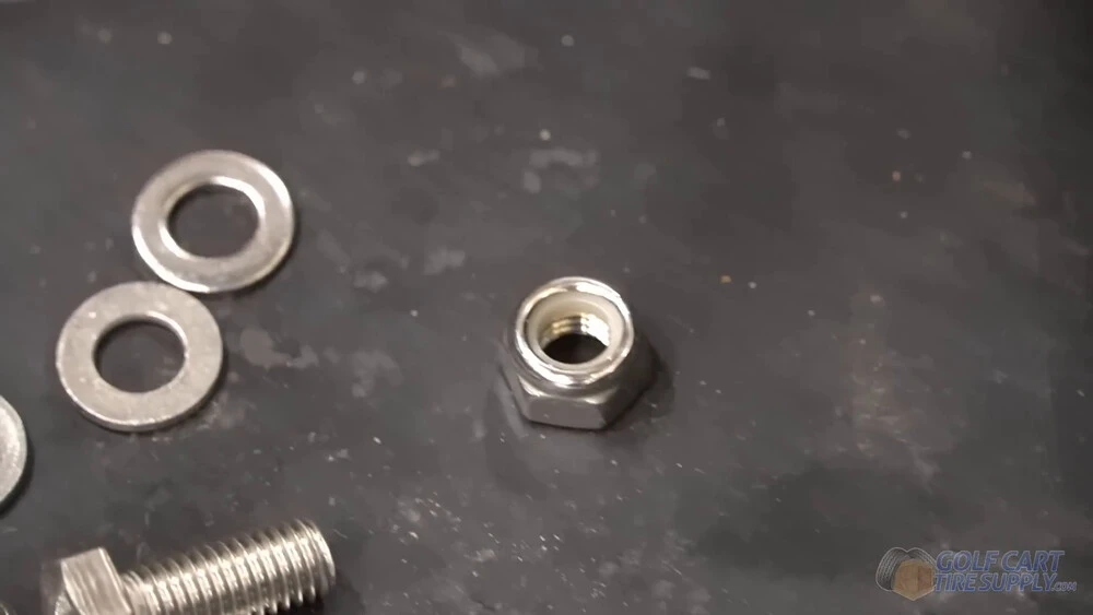 Nylon lock nuts from the ALLIED lithium kit Nylon locking nut, washers and bolt from the ALLIED kit used to mount a lithium battery in a golf cart