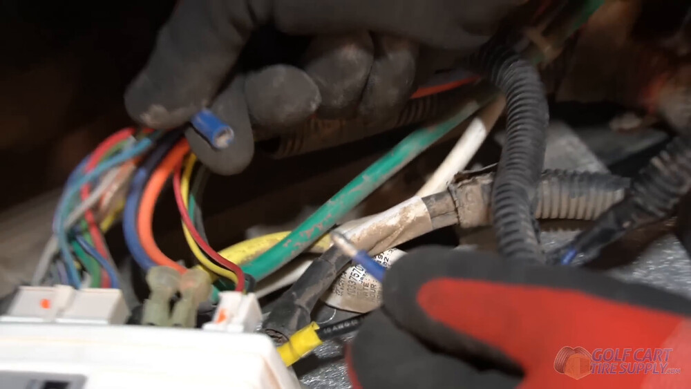 Blue charge port wire connector on a Club Car Tempo Blue charge receptacle wire at its pull-apart connector near the motor controller of a 2019 Club Car Tempo golf cart