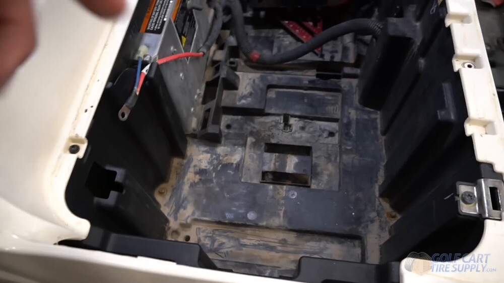 Club Car Tempo battery tray cutouts Empty battery tray with plastic cutouts after the lead-acid batteries came out of a 2019 Club Car Tempo golf cart