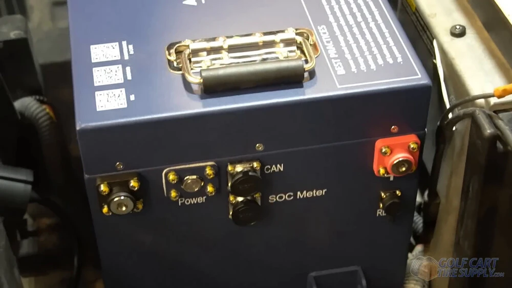 ALLIED battery ports facing the Club Car Tempo driver side Power button, CAN and SOC meter ports on the ALLIED battery facing the driver side of a 2019 Club Car Tempo golf cart