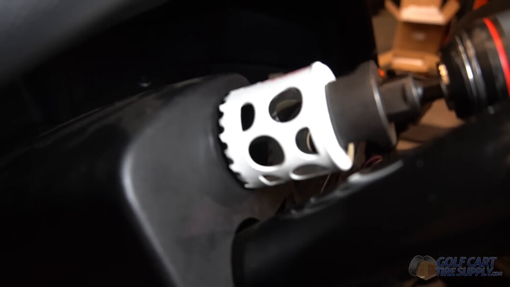 Drilling the SOC gauge hole in a Club Car Tempo dash Two inch hole saw cutting the SOC gauge hole in the center dash panel of a 2019 Club Car Tempo golf cart