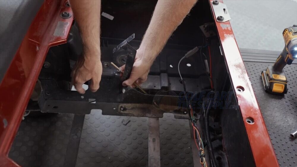 EZGO RXV battery tray with the factory mounting rods removed Empty EZGO RXV battery tray with the factory mounting rods being removed