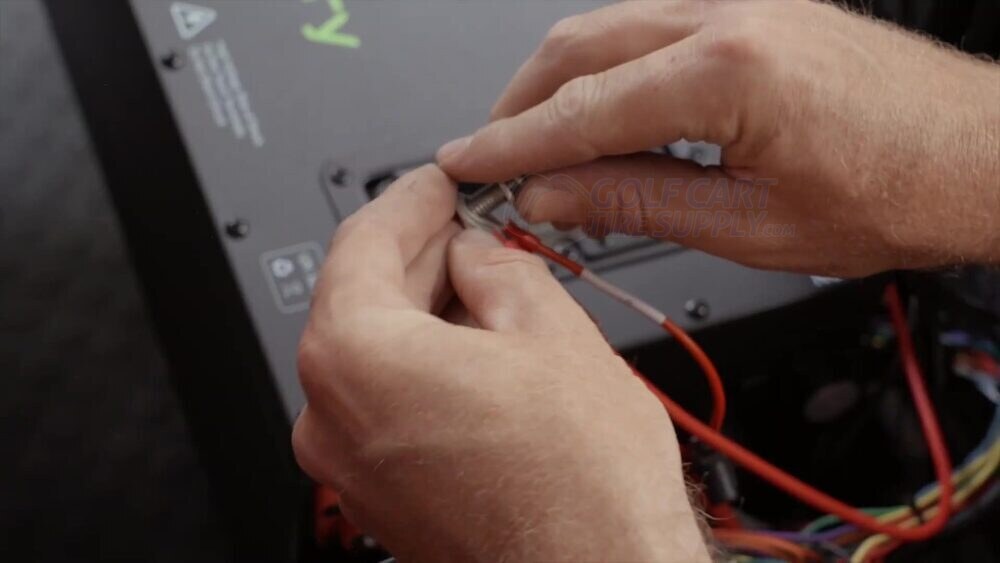Connecting the A-4137 adapter and charging lead to the ECO battery positive terminal Connecting the A-4137 adapter ring terminal and charging lead to the ECO battery positive terminal