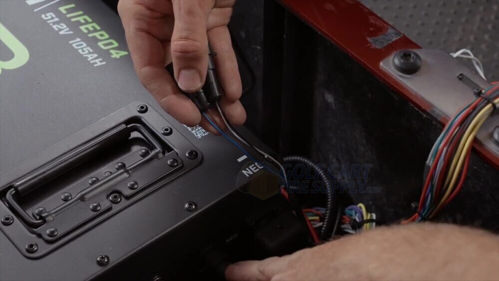 Connecting the charger CAN cable to COM port two on the ECO battery Connecting the charger CAN cable to COM port two on the ECO battery in an EZGO RXV
