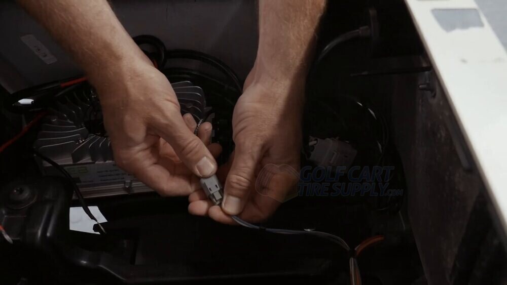 The interlock connectors joined together on an EZGO RXV ELiTE Gen 2 The charger interlock connector pushed together with the factory harness interlock on a Gen 2 EZGO RXV ELiTE